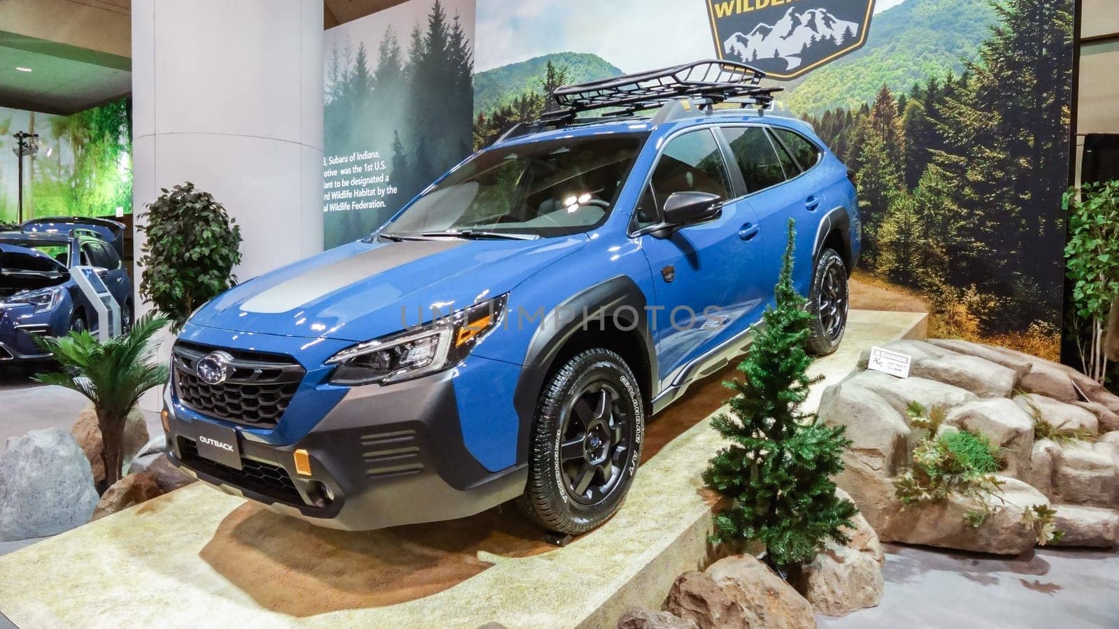 Crowds looking at new car models at Auto show. Subaru outback car on display. National Canadian Auto Show with many car brands. Toronto ON Canada Feb 19, 2023. by JuliaDorian