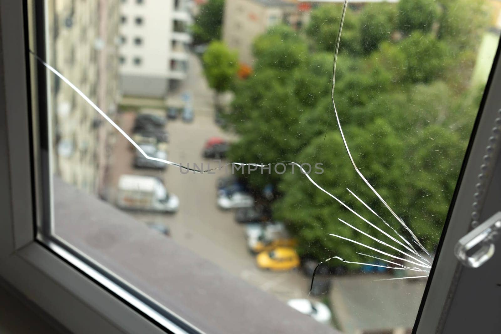 Crack, Broken Glass In A Double-glazed Window Due To Manufacturing Defect In Building, Home. Guarantee Manufacturer's Defective Products. Warranty. Horizontal Plane. Closeup. High quality photo