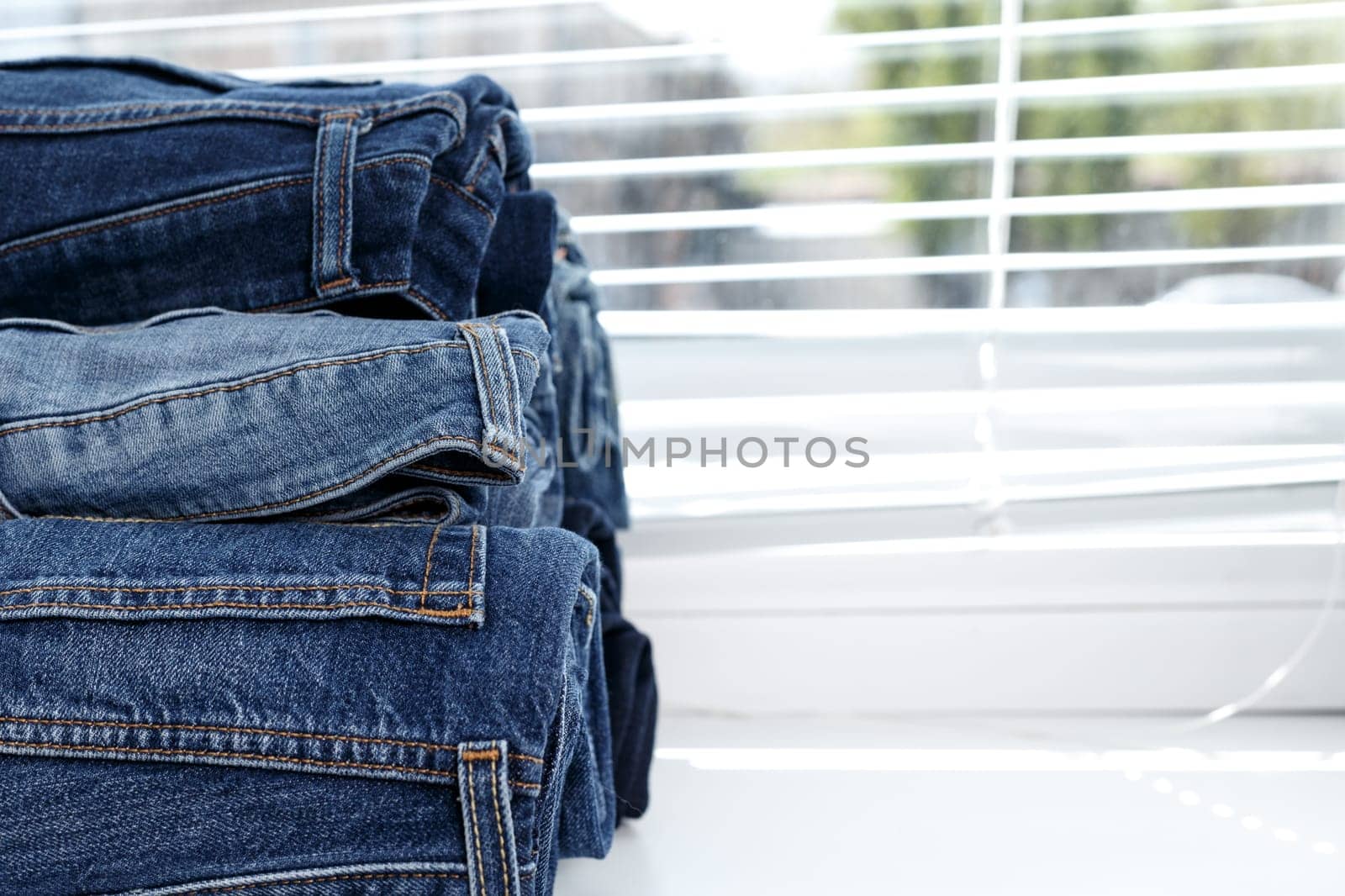 torn jeans stack background blue denim fashion beauty