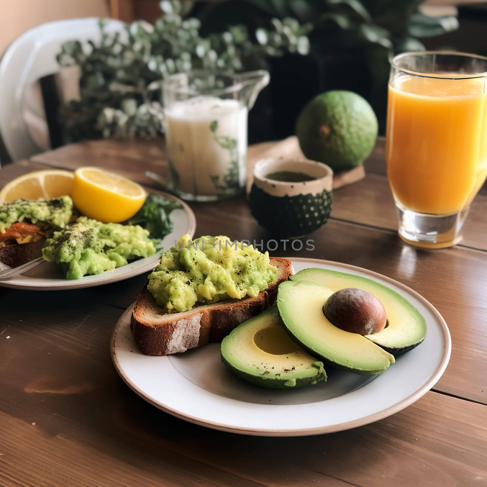 Tasty breakfast with avocado toast and orange juice by banate