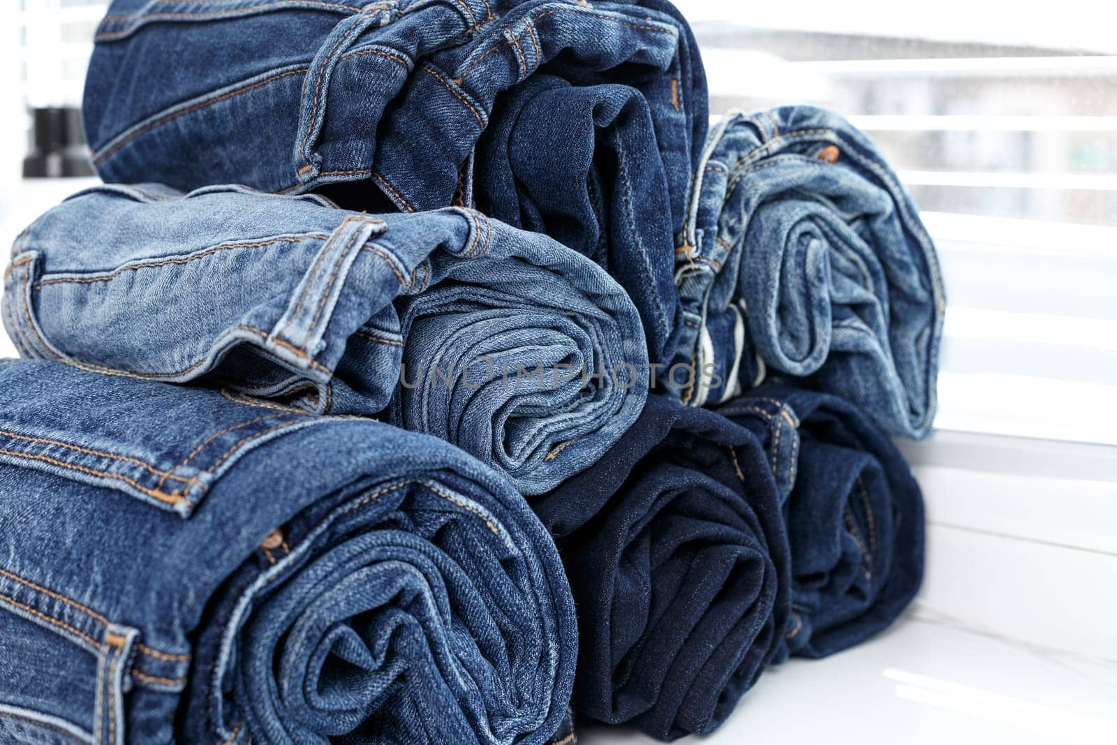 torn jeans stack background blue denim fashion beauty by Fabrikasimf