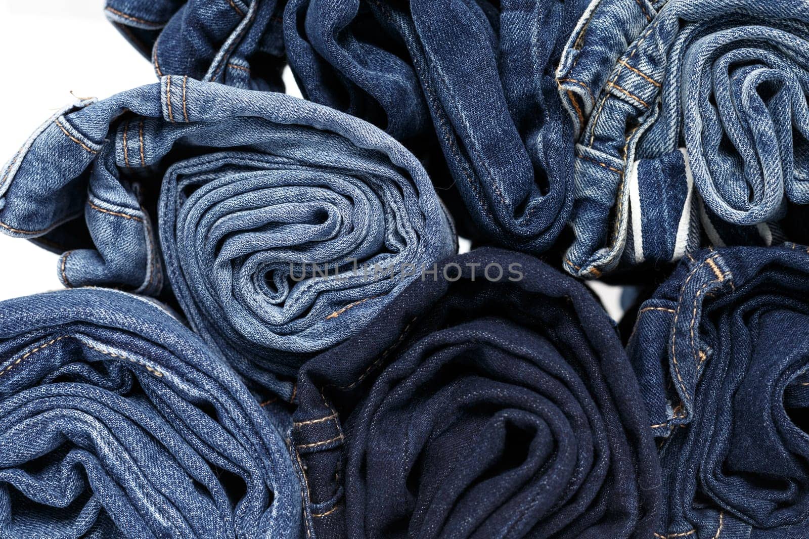 torn jeans stack background blue denim fashion beauty by Fabrikasimf