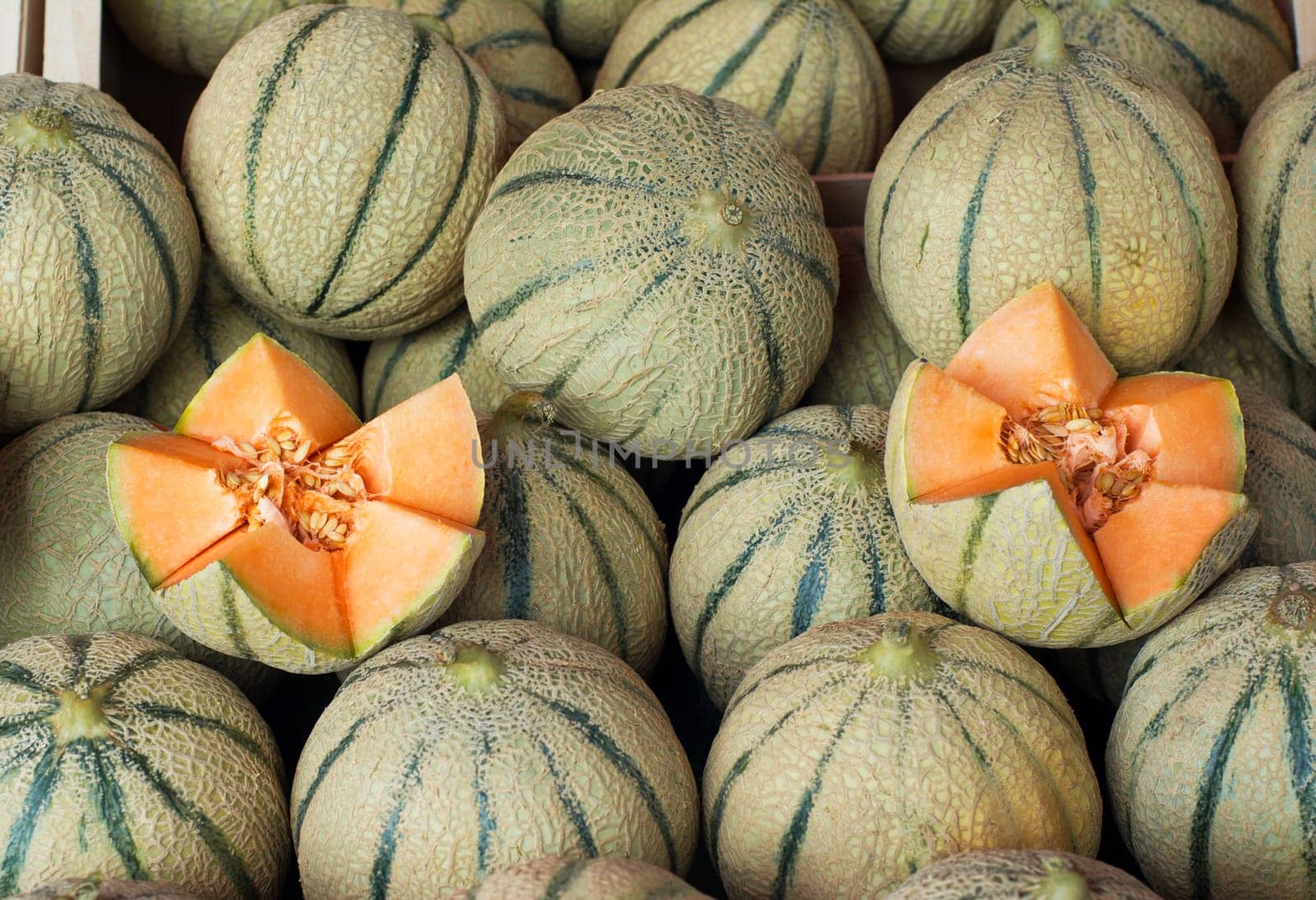 Sweet melons on the shelves of the French market