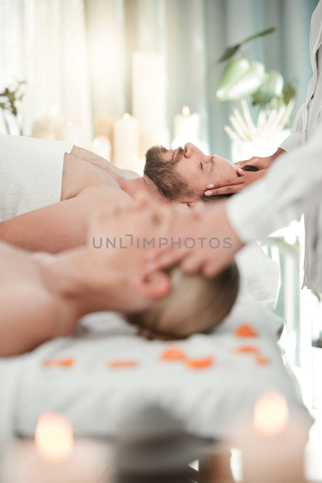 Man, spa and bed for luxury massage to relax, breathe and zen on vacation, holiday or hotel with woman. Couple, mindfulness and love for health at wellness, care and physical therapy for healing.