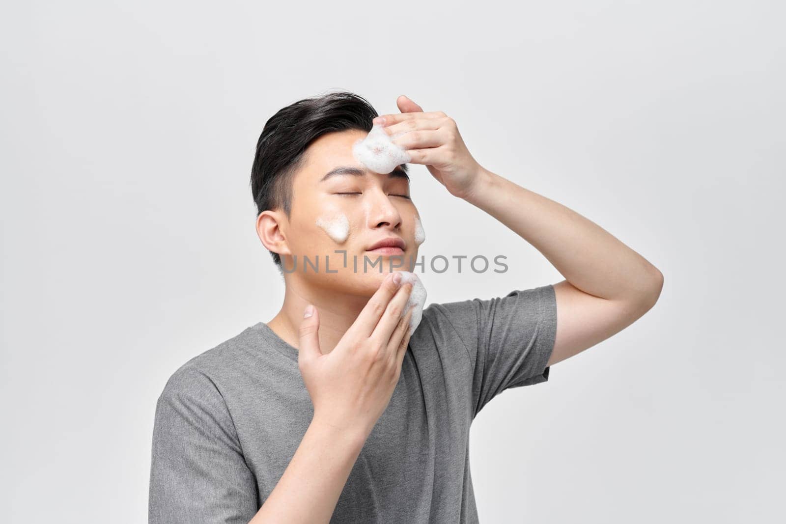  Happy Guy Cleansing Face Applying Facial Cleanser Closeup