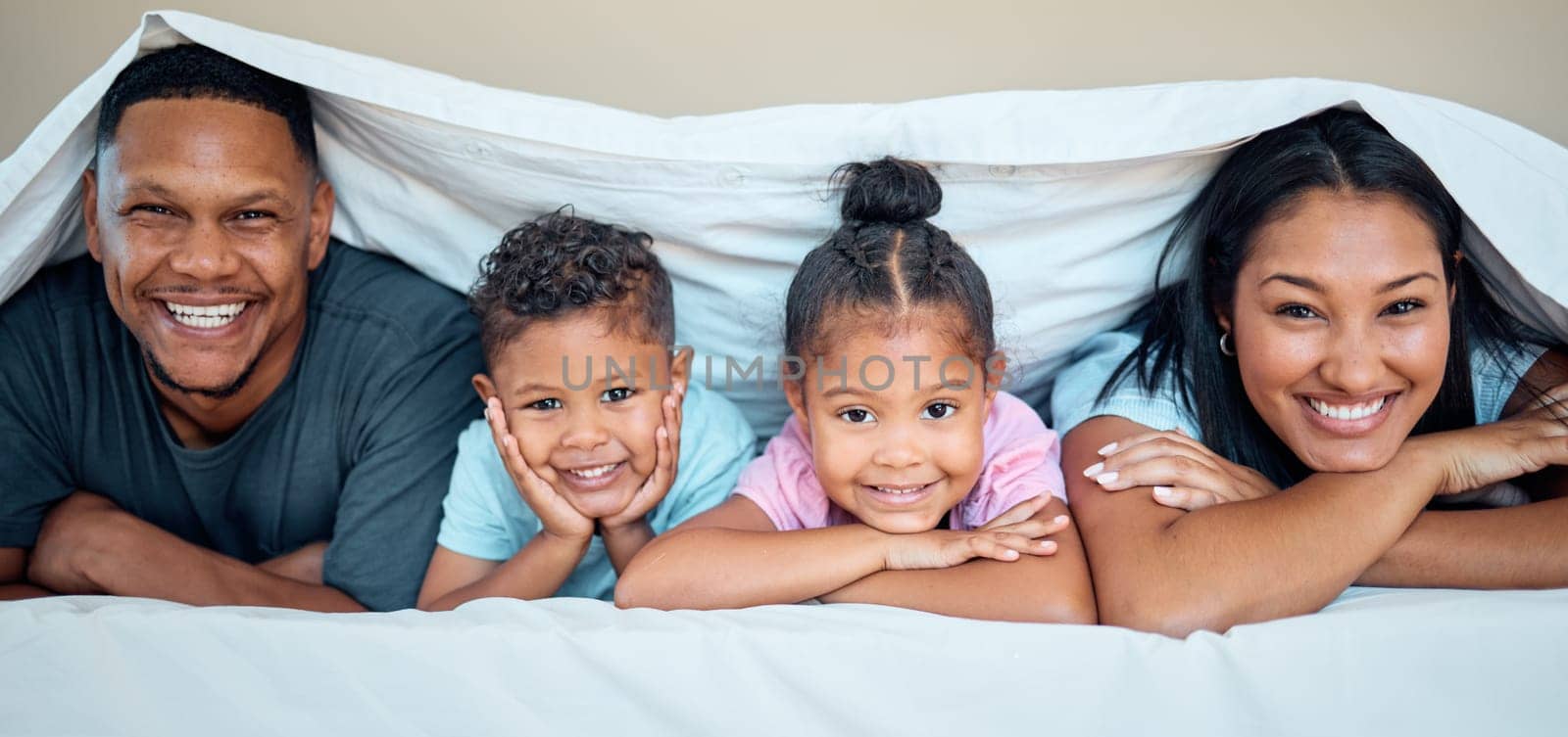 Love, bed and portrait of family with blanket spending quality time, bonding and having fun on weekend. Happiness, black family and mother with dad and children posing in bedroom to relax in morning.