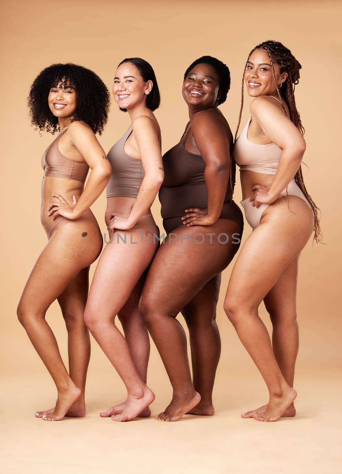 Diversity women, skin and body positivity portrait of friends together for inclusion, beauty and power. Underwear model group on beige background with cellulite, pride and motivation for self love.