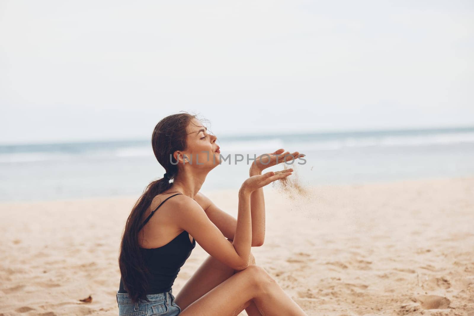 woman sea sand vacation relax freedom smile travel sitting nature beach by SHOTPRIME