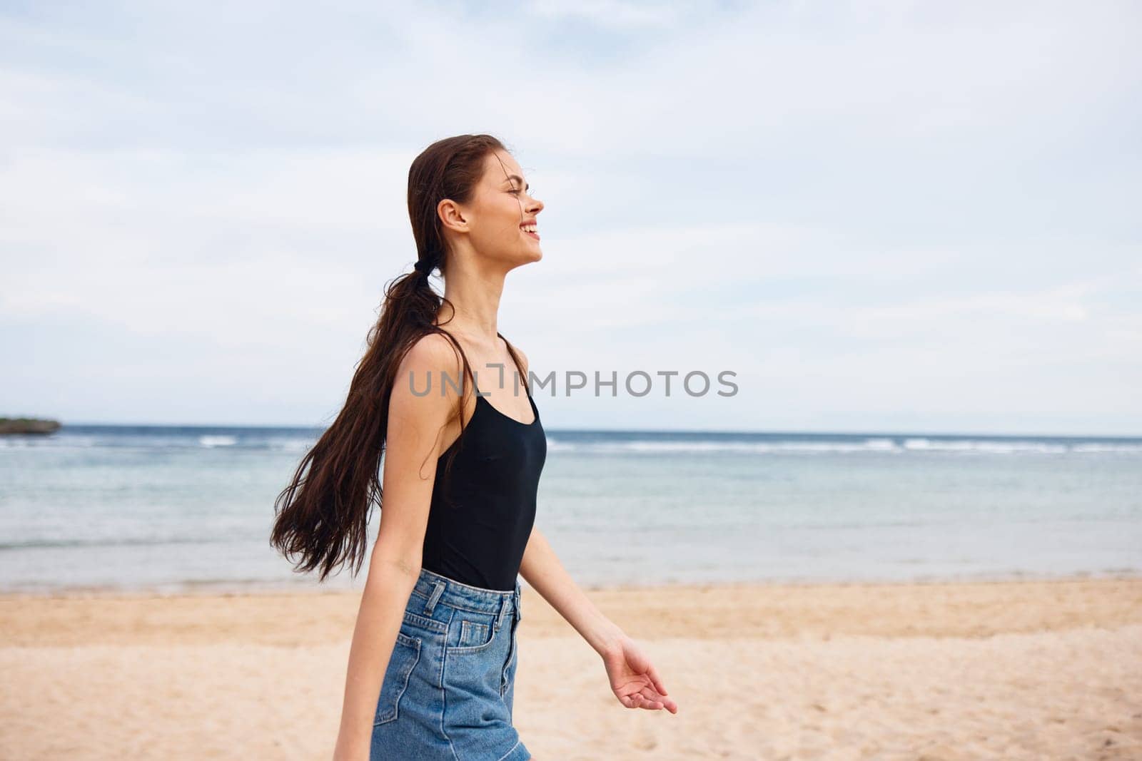 leisure woman young summer vacation activity space sand flight beach running smile sea happiness body travel lifestyle copy wave sunset smiling happy