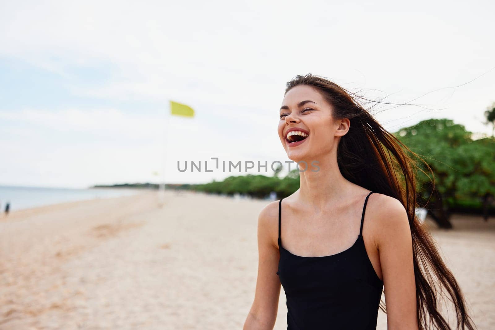 woman sunset walking freedom nature ocean summer beach smile tropical sand girl relax dress hair sea enjoyment long sky vacation young adult