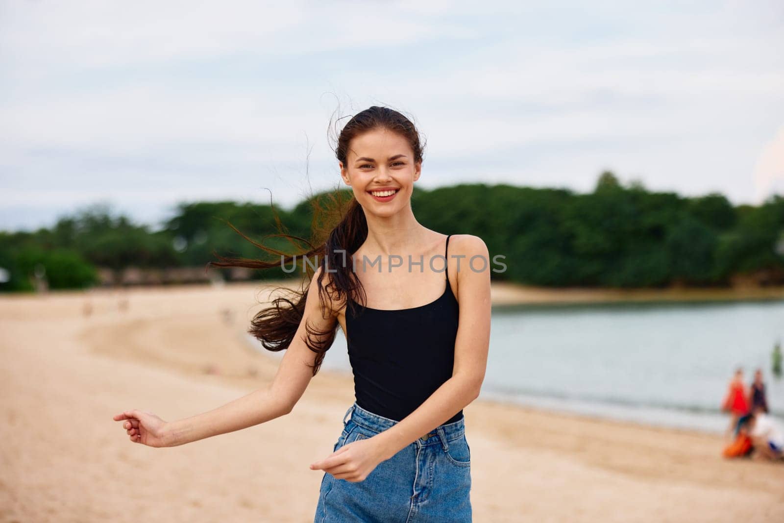 woman walking shore sunset beauty young leisure sea running beautiful hair travel beach person fun happy lifestyle active vacation summer smile