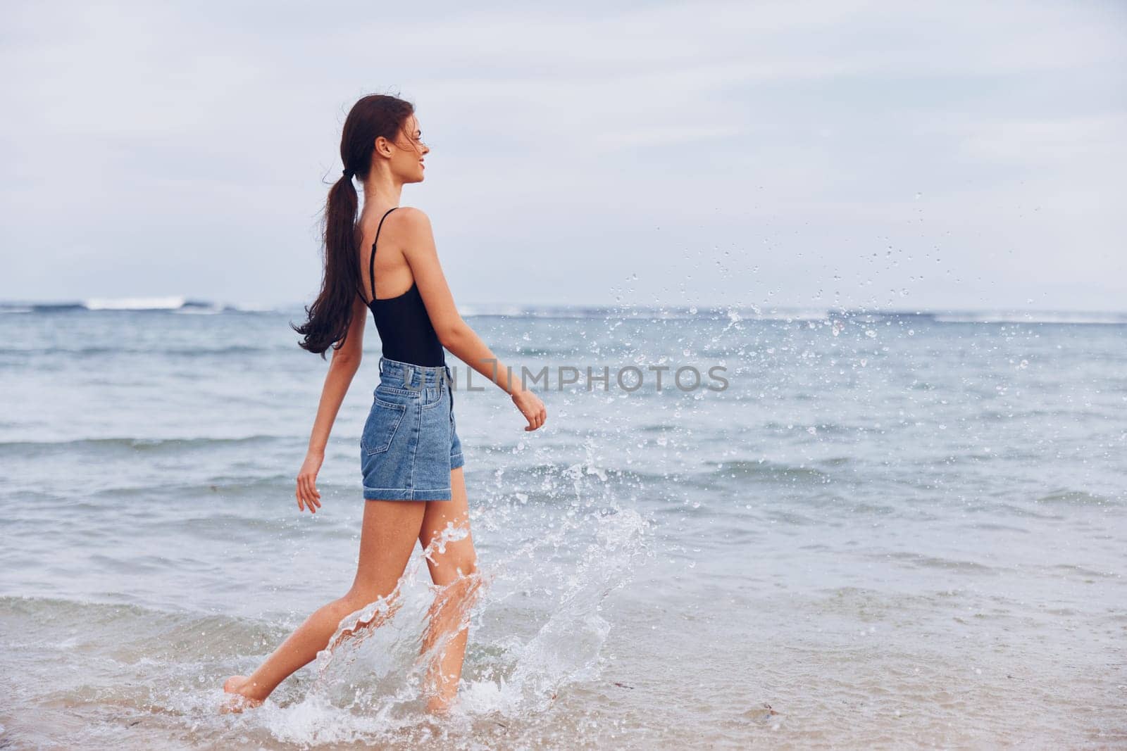 woman sea beautiful space sexy beach tan travel lifestyle bikini hair girl summer running copy smile vacation sunrise ocean carefree sunset young