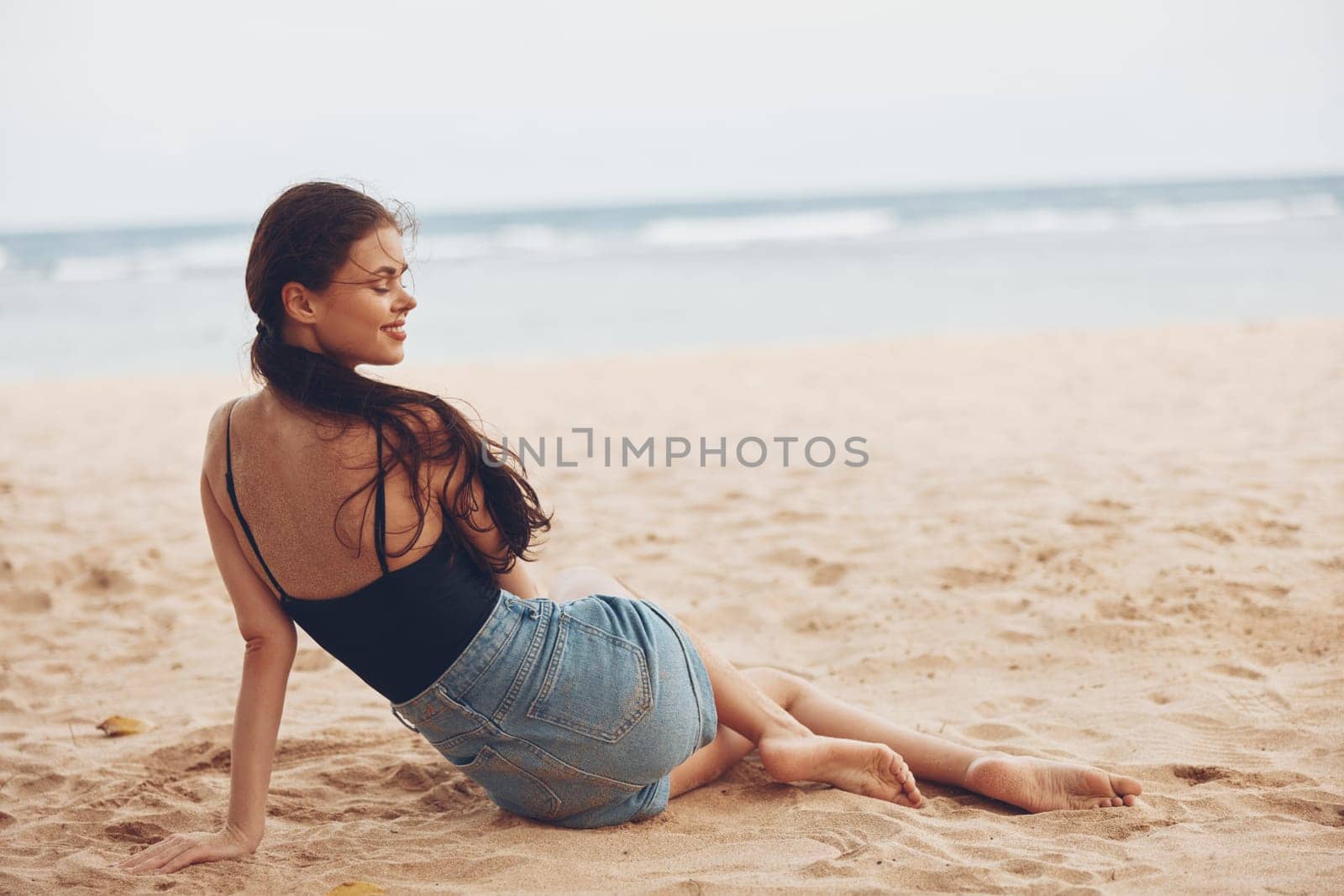 woman smile sea sitting vacation beach coast travel nature freedom sand by SHOTPRIME