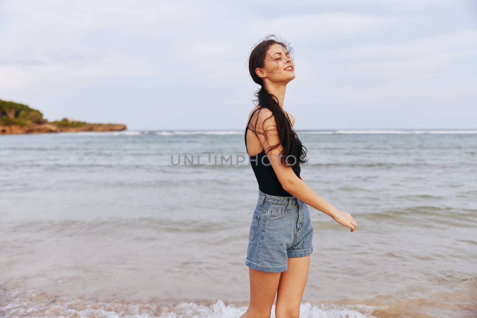 vacation woman space running jean sunset nature beach lifestyle holiday happiness sand smile female ocean sea copy freedom copy-space tropical carefree summer