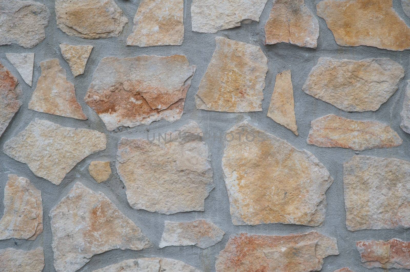 texture of an exterior stone wall of a residence