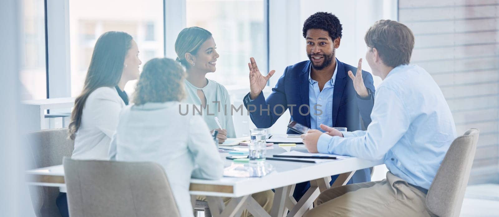 Happy, explaining and black man in a meeting for a presentation, planning and workshop. Business, communication and employees talking about a corporate project, idea or plan in a team seminar.