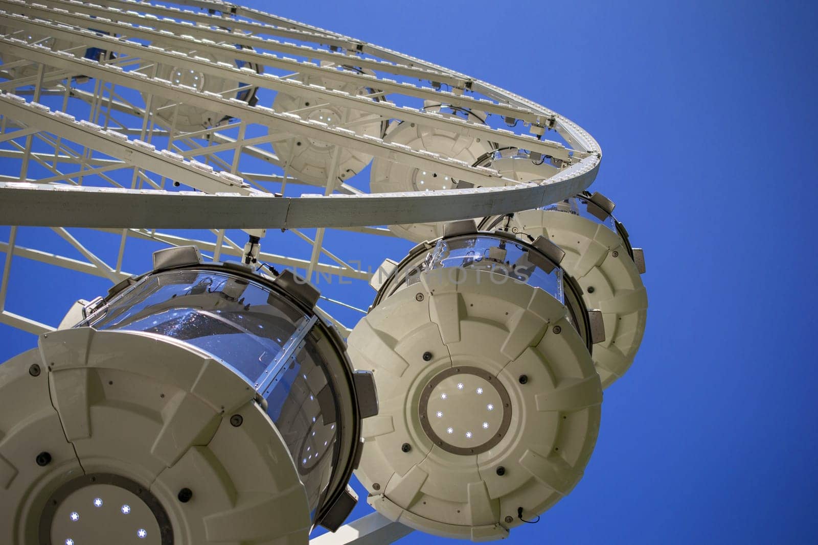 Ferris Wheel Over Blue Sky by Maksym