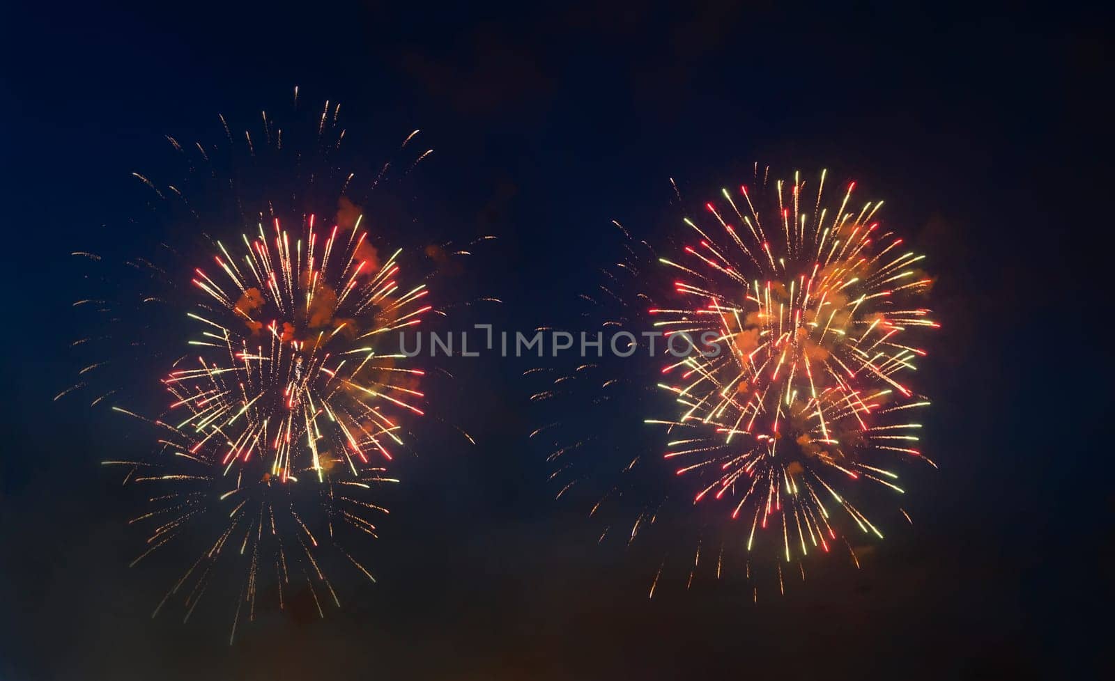 Many multicolour fireworks on night sky