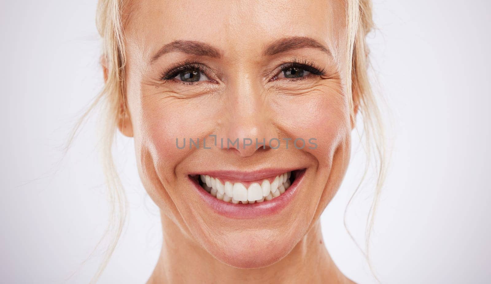 Teeth whitening, portrait and smile of woman in studio, beauty background and fresh mint breath. Happy female model, face and skincare for dental wellness, tooth implant and aesthetic facial salon.