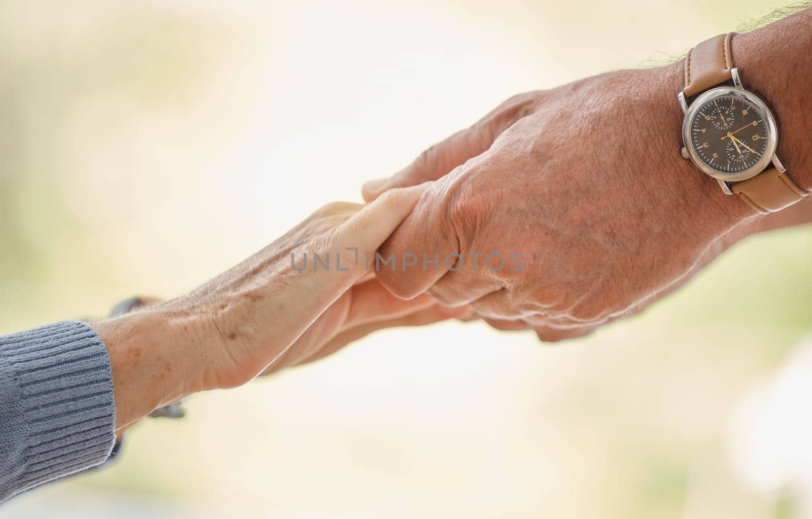 Holding hands, support and trust with senior couple, love and solidarity with helping hands and partnership outdoor. Help, commitment and faith, elderly people with hand holding, together and love