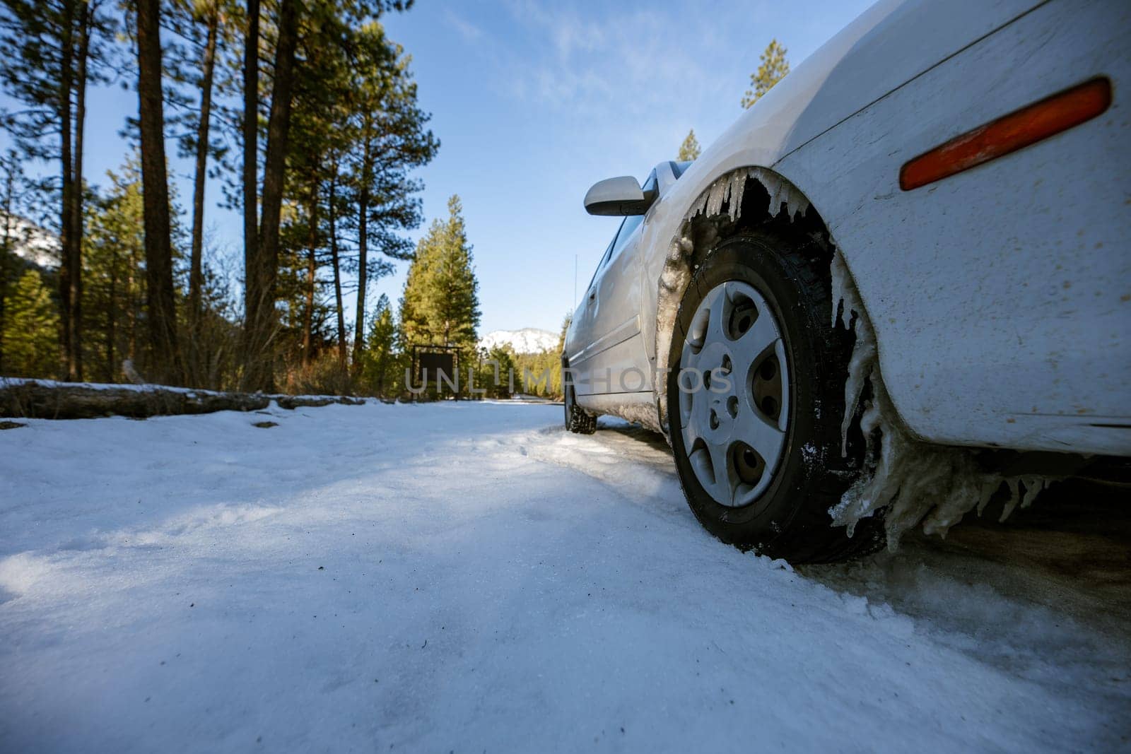 tire covered in snow on a frozen day