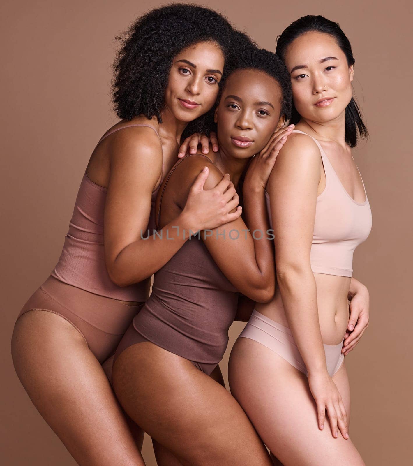 Beauty, diversity and skincare with portrait of women for self care, body positive and cosmetics. Wellness, products and natural with model for community, facial and luxury in brown background studio by YuriArcurs