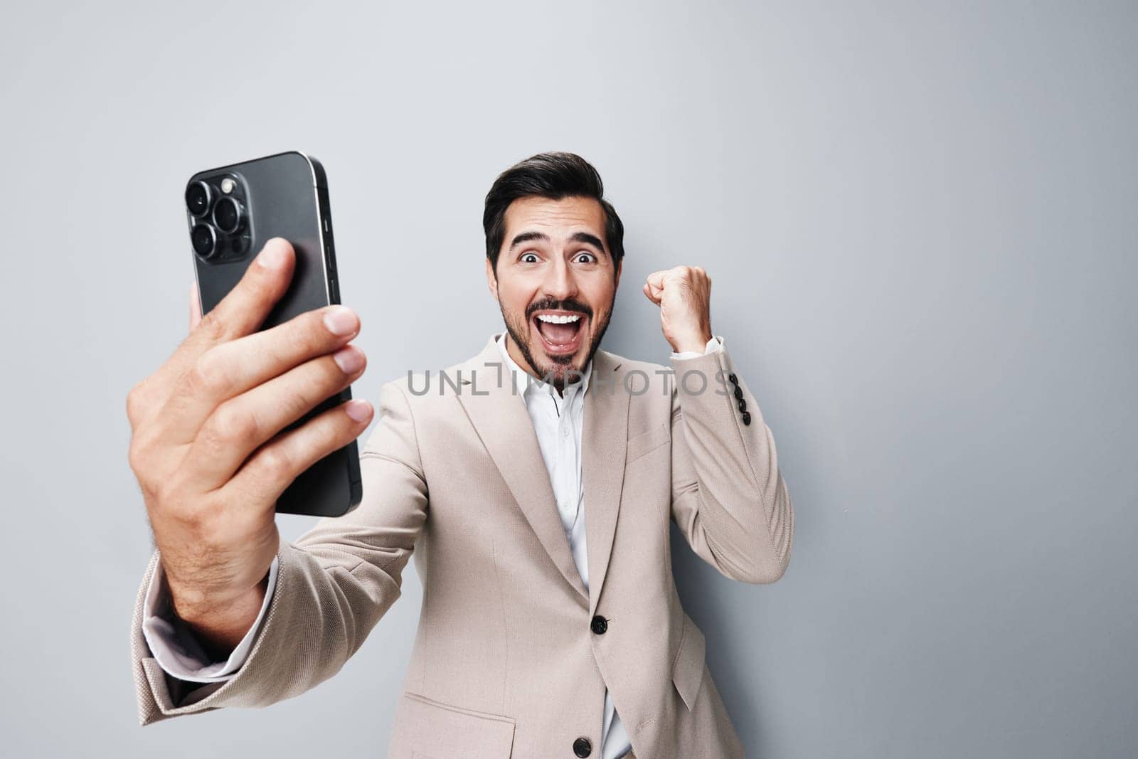 smile man young suit smartphone hold business happy phone call portrait by SHOTPRIME