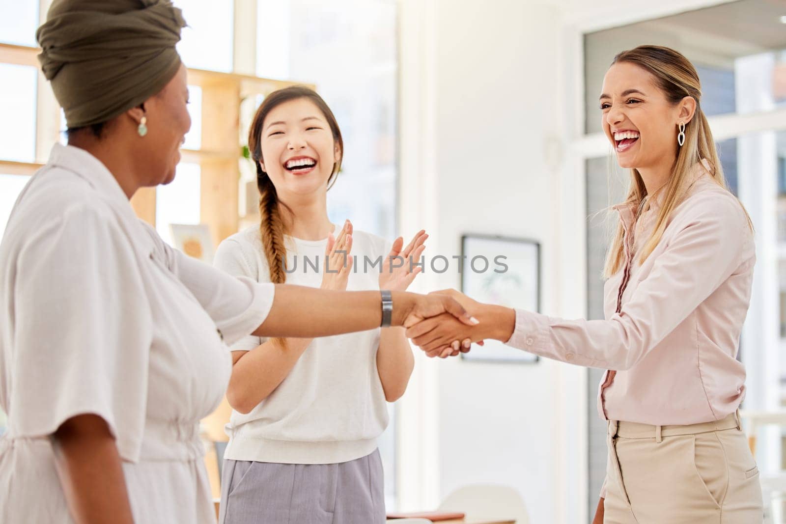 Handshake, welcome and thank you with businesswomen in teamwork, collaboration and communication in office. Success, b2b partnership and trust or business people shaking hands in corporate meeting. by YuriArcurs