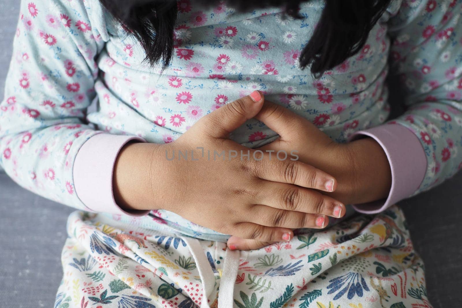 child suffering stomach pain close up..