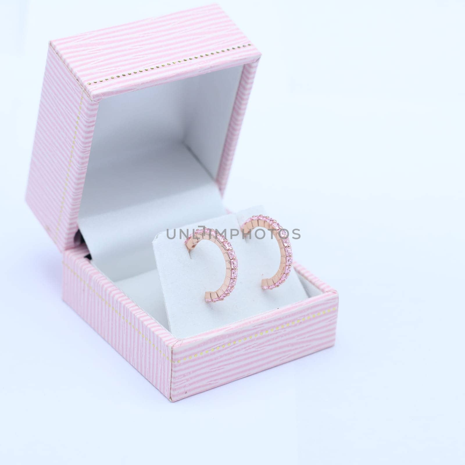 Pink jewelry box with earring by nantachai