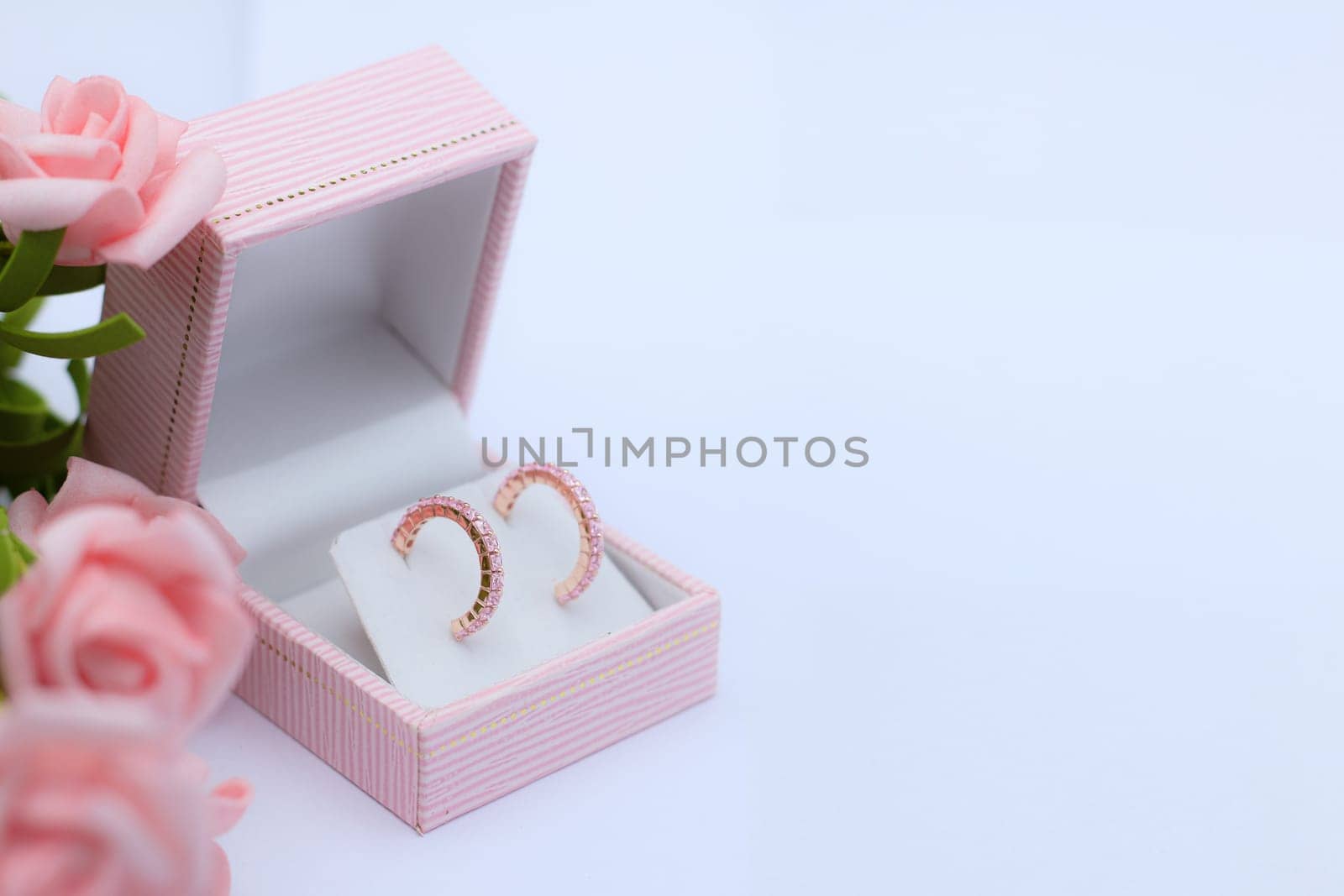Pink jewelry box with earring by nantachai