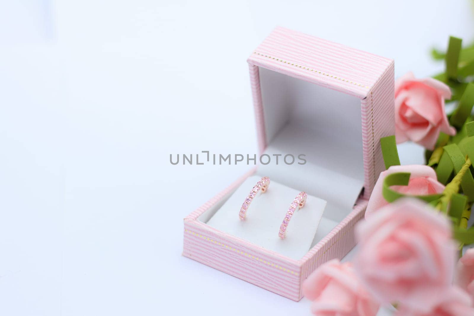 Pink jewelry box with earring by nantachai