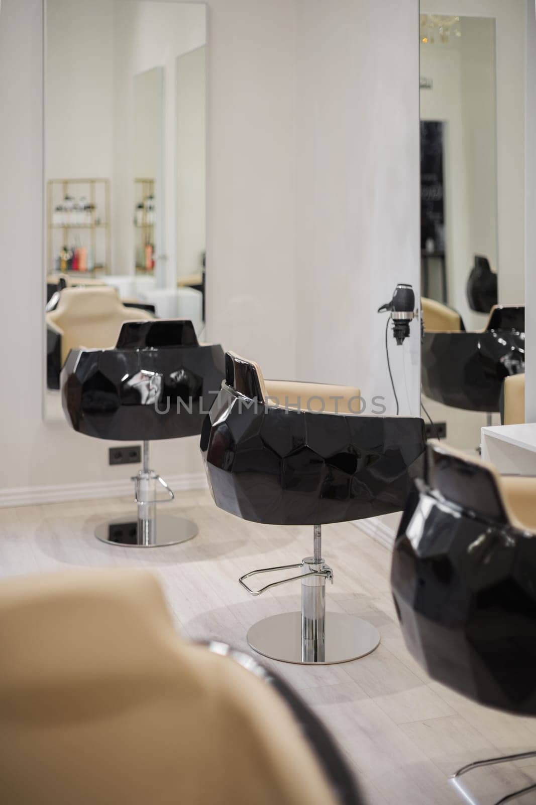 Interior of beauty salon with chairs and mirrors. Furniture in modern hairdressing by apavlin