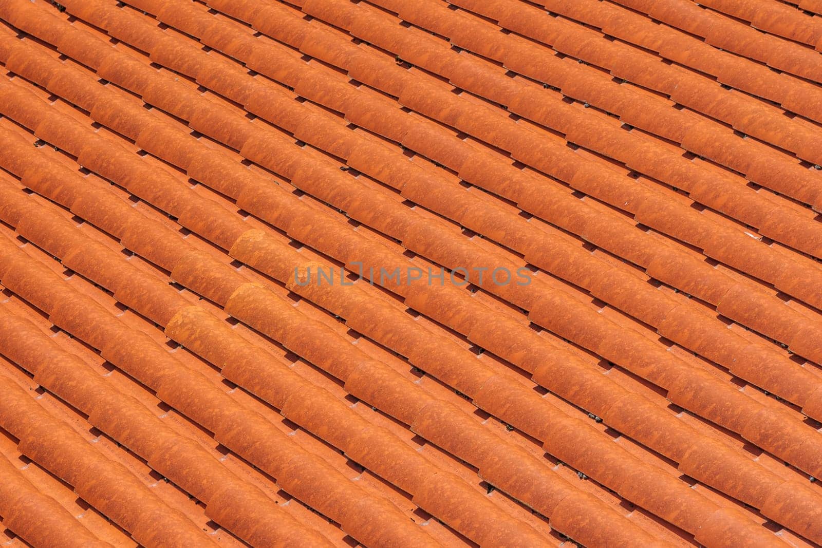 Close-up of new clay ceramic roof tiles on a building.