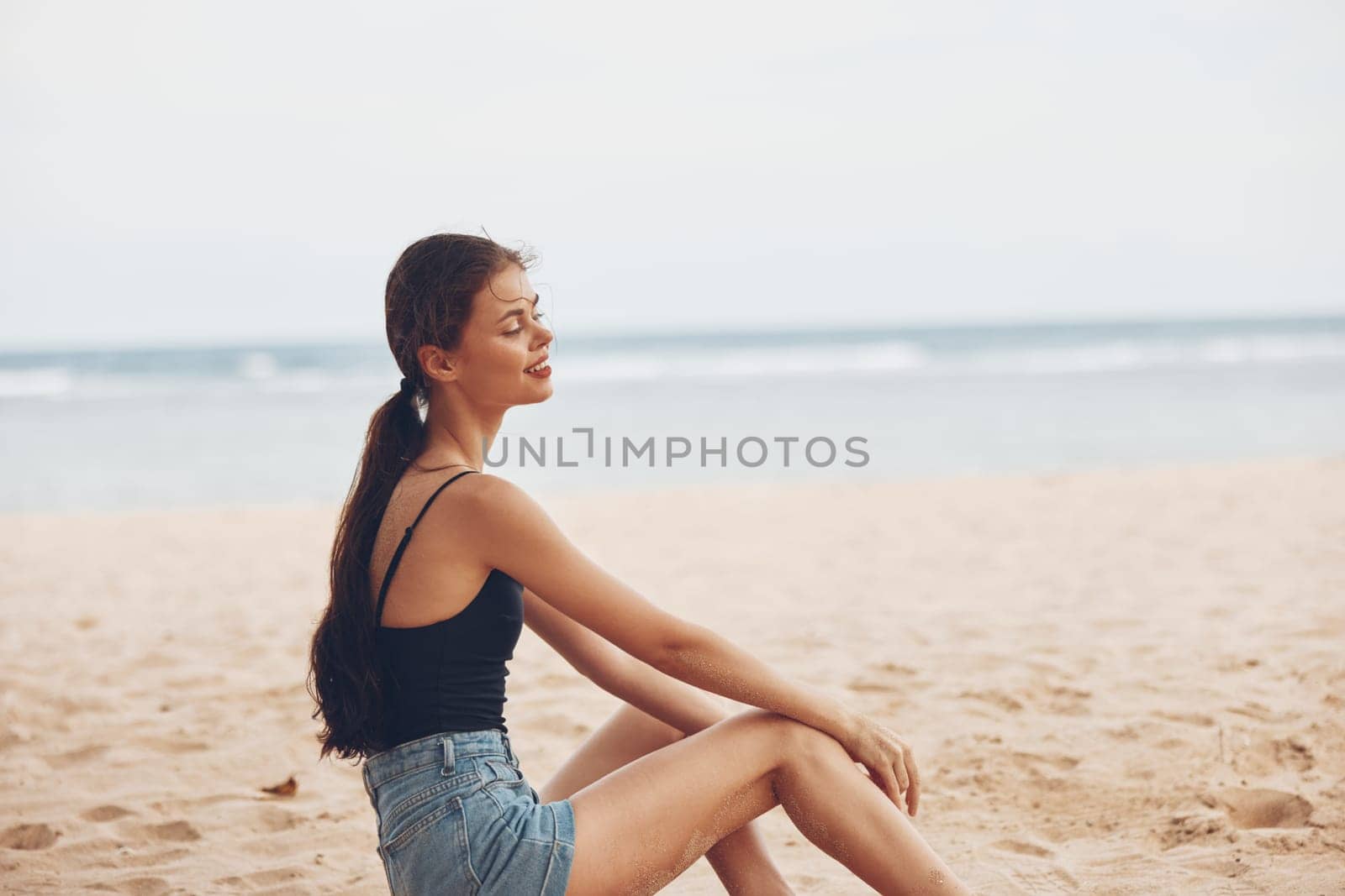 woman adult sitting girl fashion back beach sea pretty smile water nature view tropical sexy white vacation young travel sand freedom caucasian