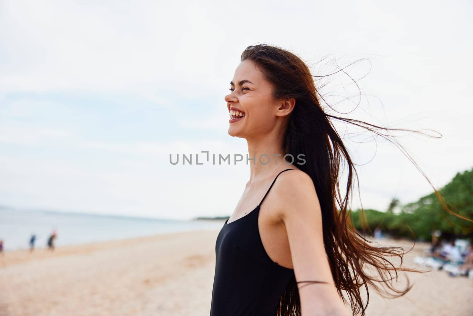 woman ocean young smile peaceful sunlight travel smiling bag sand happiness beach free shore vacation person walk summer nature sea female