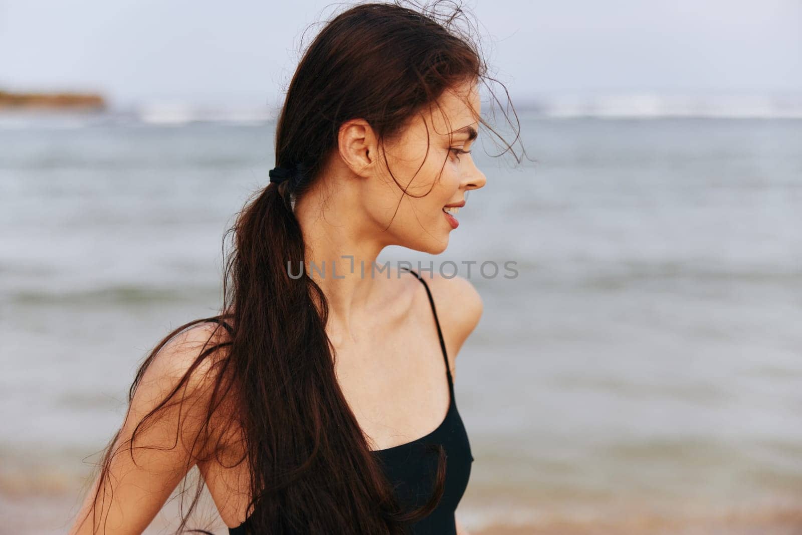 woman free sea beauty copy space smile beach sunset vacation sun relax carefree lifestyle coast sand happy copy-space adult peaceful ocean summer