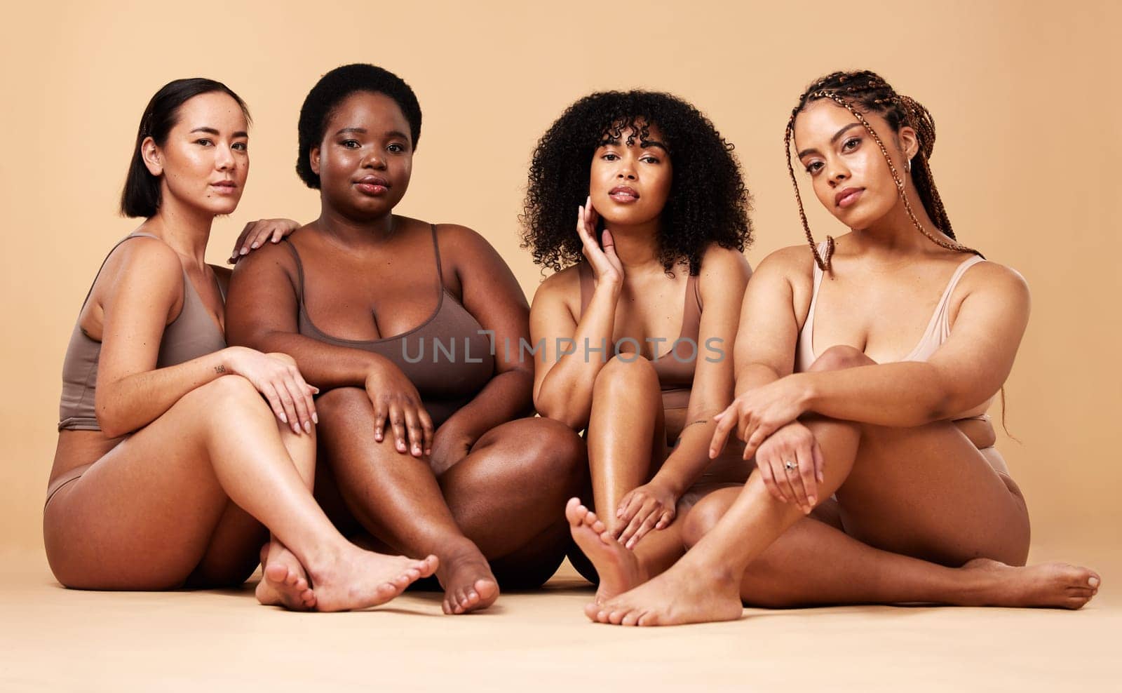 Body, diversity and portrait of natural women group together for inclusion, beauty and power. Aesthetic model people or friends on beige background with skin glow, pride and motivation for self love by YuriArcurs