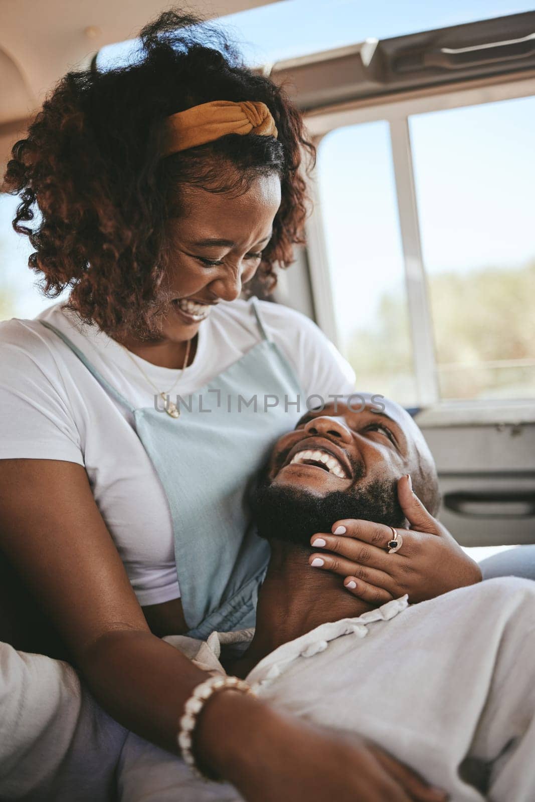 Black couple, smile and laugh for love in road trip adventure, travel and relaxing together. African American man and woman in loving, caring and embracing relationship for traveling in nature by YuriArcurs