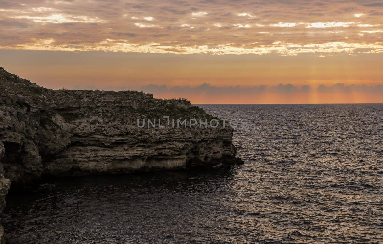 Beautiful Sunset in the clouds over the Black Sea in eastern Crimea