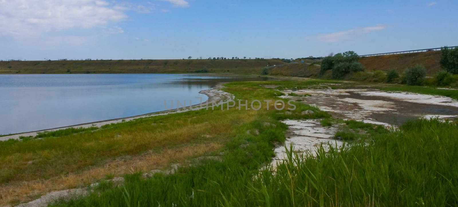 Shallow bay of the Tiligulsky estuary with wild salt-tolerant vegetation on the shore, Ukraine