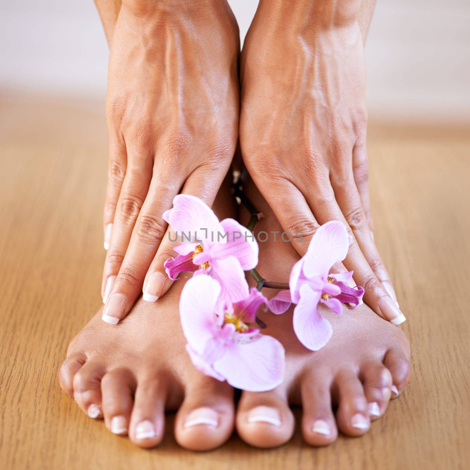 Skincare girl and hands with flowers on feet for luxury cosmetic treatment with manicure and pedicure nails. Healthy skin of black woman with orchid for beauty, wellness and pamper lifestyle. by YuriArcurs