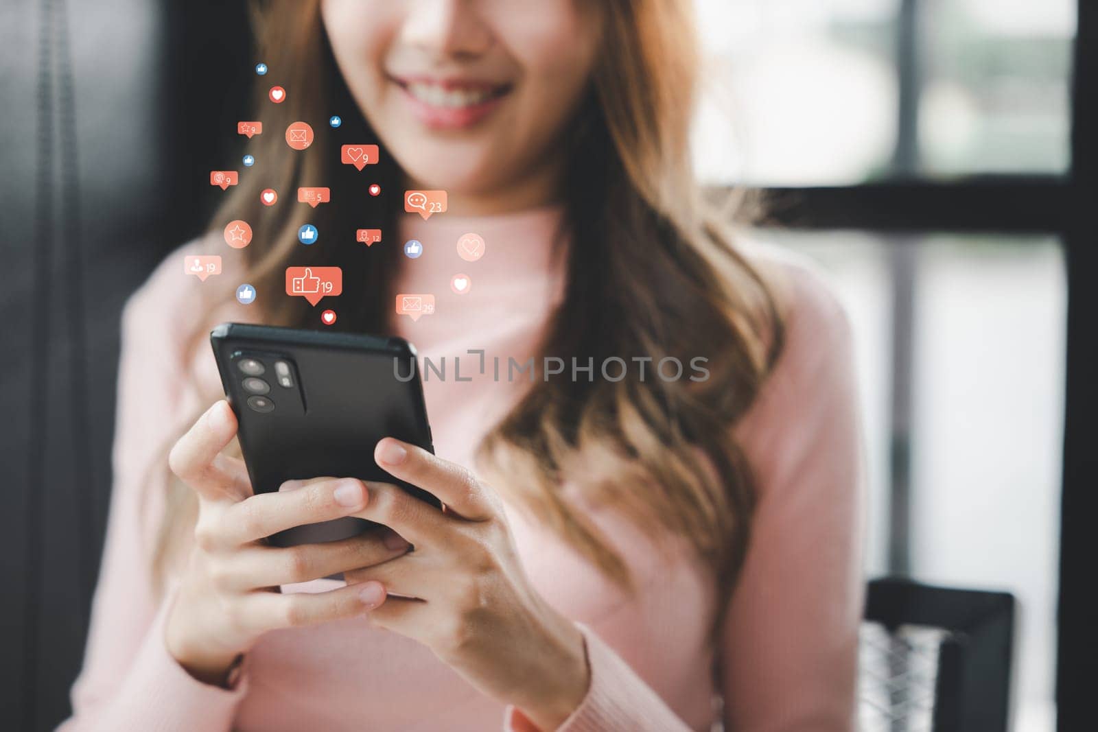 Happy beautiful female typing text message on smart phone device and enjoyment lifestyle with social networking media, Asian young woman using mobile phone at cafe coffee shop to shopping online