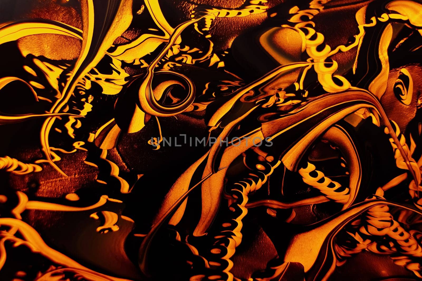 Abstract background with swirling paint effect. Liquid acrylic artwork with colorful mixed paints. Can be used for wallpaper, background or poster. orange and black colors. Highly-textured oil paint. Marble texture