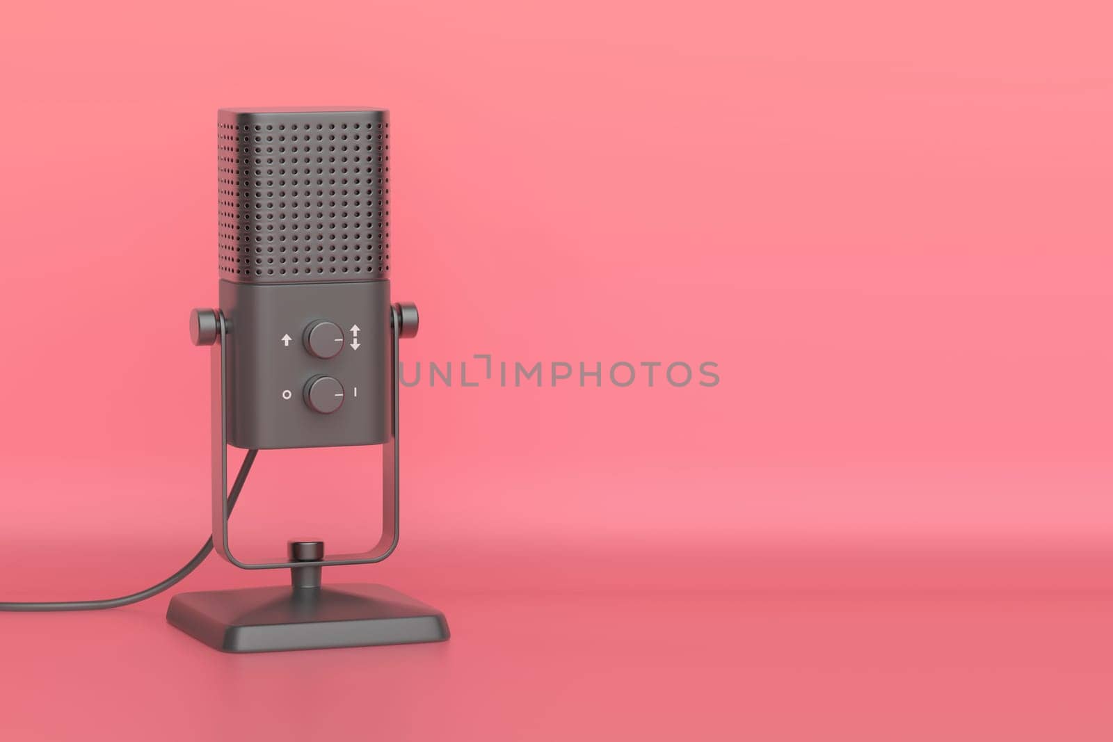 Black studio microphone on pink background