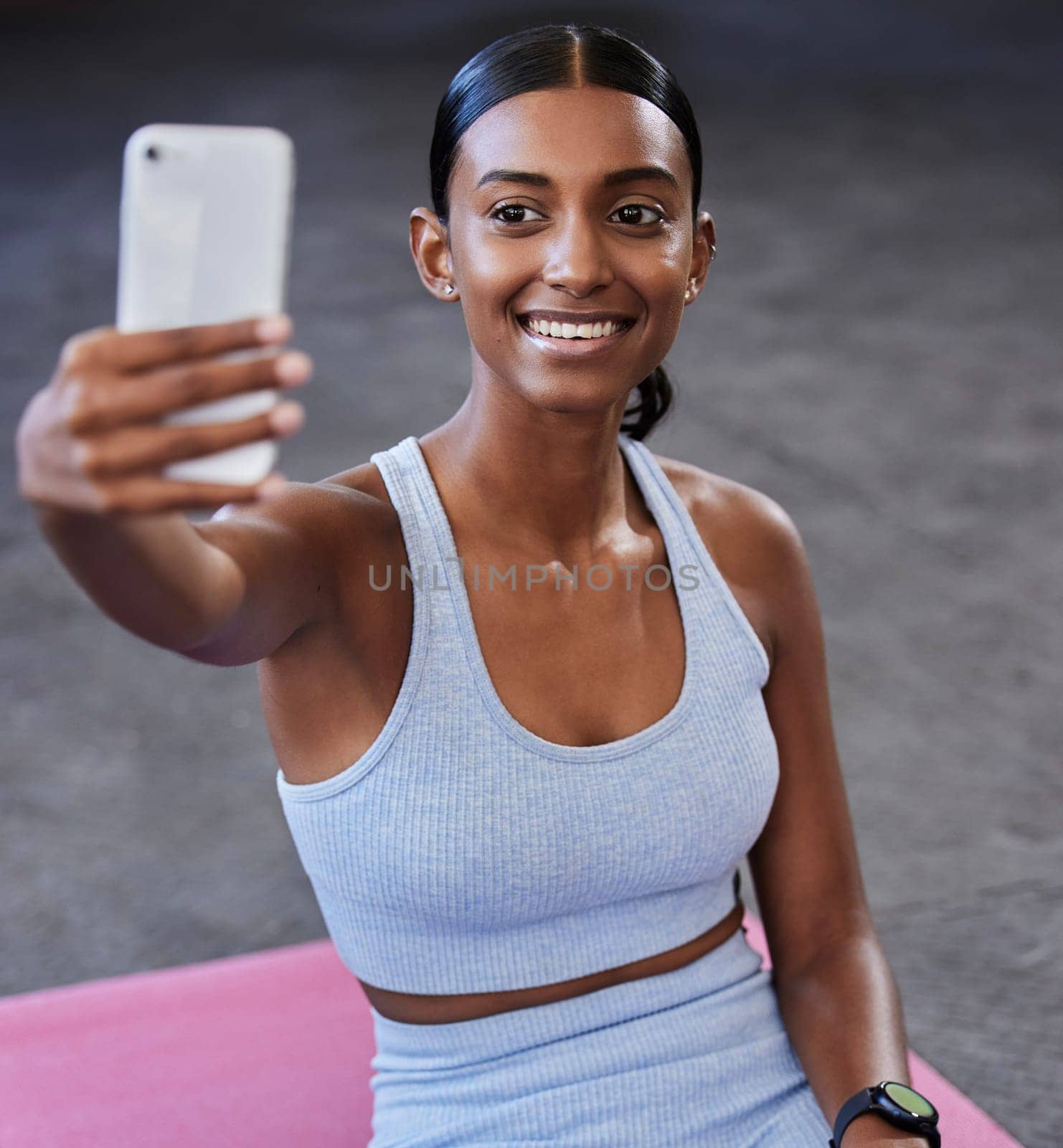 Fitness selfie, sports floor and woman with social media post, profile picture update or wellness website blog on mobile app. Smartphone photography, Indian athlete and pilates or cardio gym training by YuriArcurs