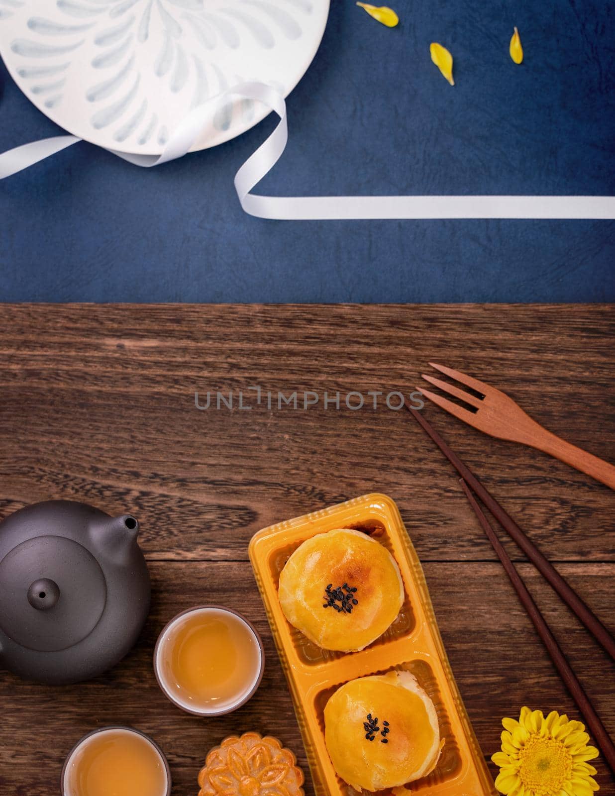 Creative Moon cake Mooncake design inspiration, enjoy the moon in Mid-Autumn festival with pastry and tea on wooden table concept, top view, flat lay