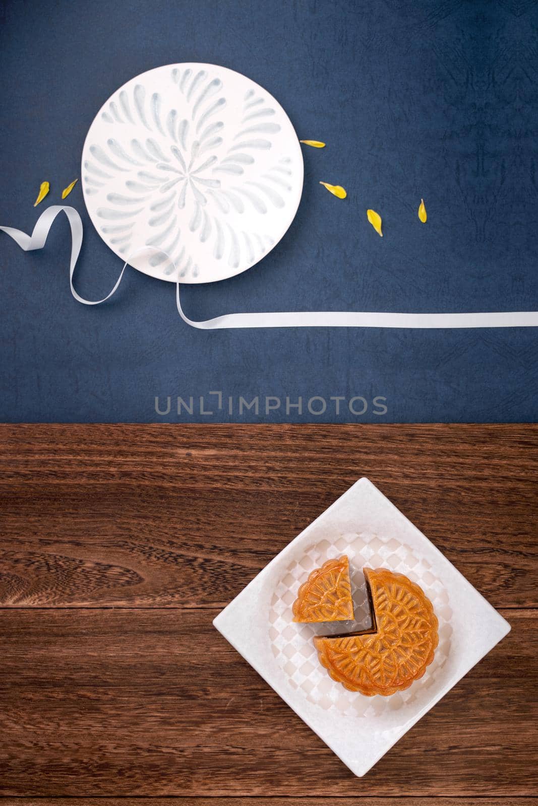 Creative Moon cake Mooncake design inspiration, enjoy the moon in Mid-Autumn festival with pastry and tea on wooden table concept, top view, flat lay