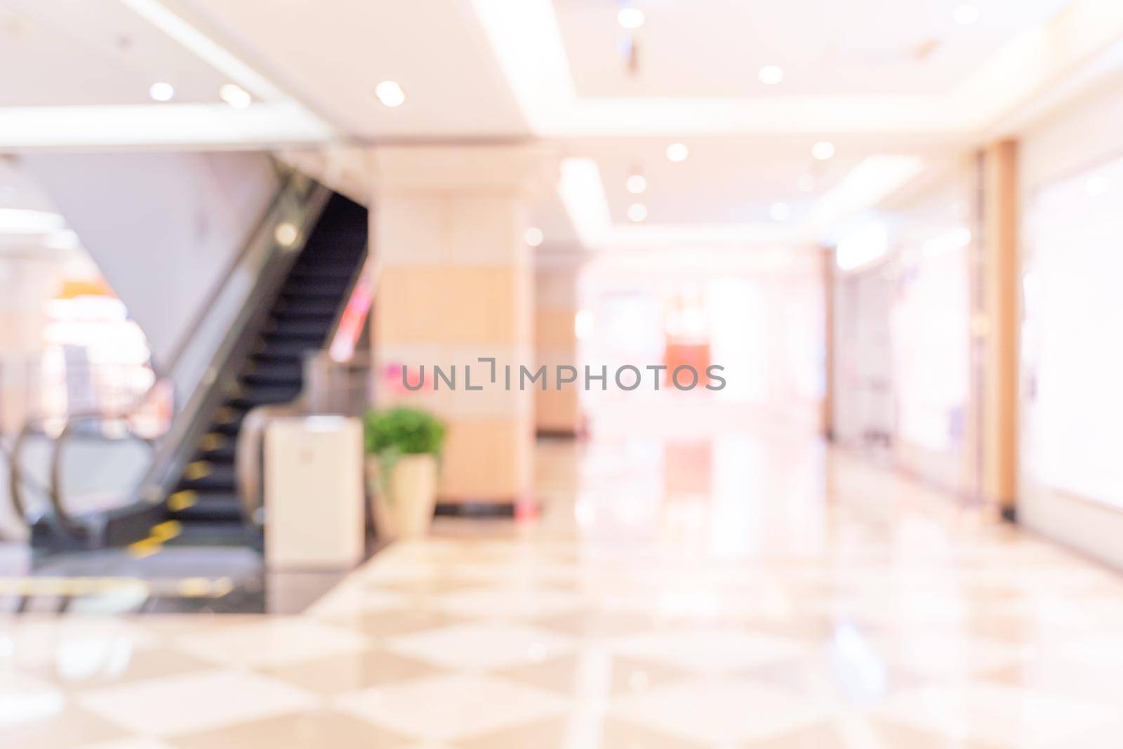 Luxury department store shopping mall interior, abstract defocused blur with bokeh background, concept of shopping seasons design.