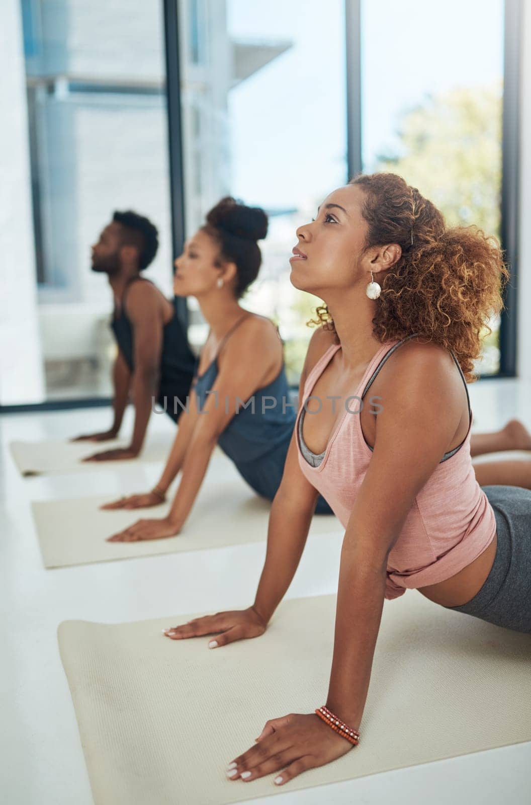 Shot of a group of people doing yoga.
